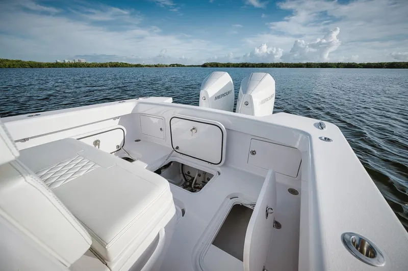 New Build Yacht Photos Pics 2024 Birdsall 30 boat interior with storage compartments and twin engines on a calm lake.