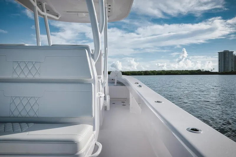 New Build Yacht Photos Pics 2024 Birdsall 30 boat interior with white seating, on calm water under a blue sky.