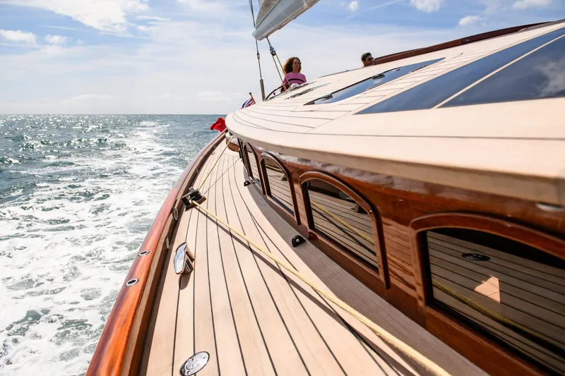 Gwenhyfar II Yacht Photos Pics 2023 Spirit Yachts C72 sailing on open sea, showcasing elegant wooden deck design.