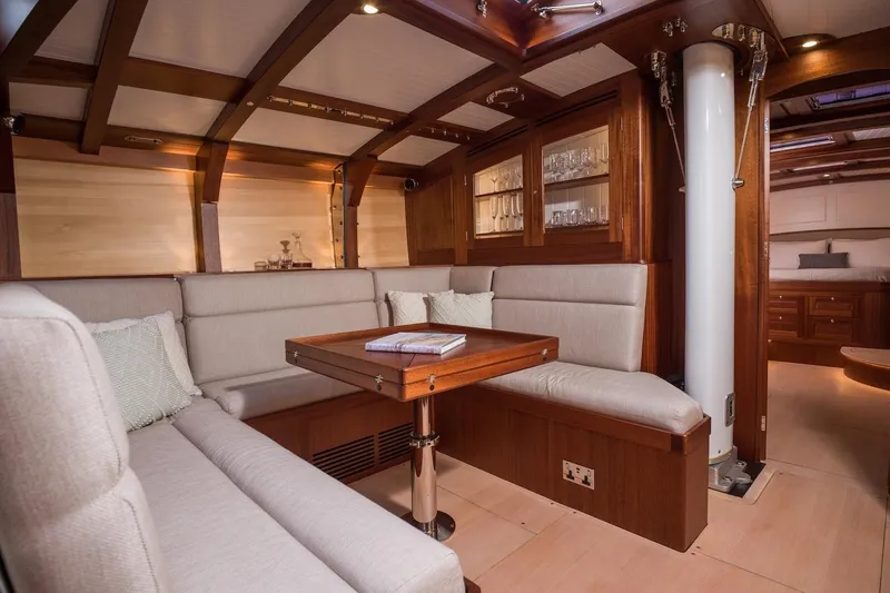 Gwenhyfar II Yacht Photos Pics Luxurious interior of 2023 Spirit Yachts C72, featuring elegant wood and plush seating.