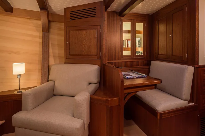 Gwenhyfar II Yacht Photos Pics Luxurious interior of 2023 Spirit Yachts C72 with elegant wood finish and cozy seating.