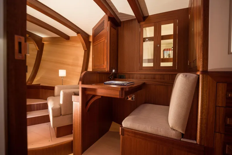 Gwenhyfar II Yacht Photos Pics Luxurious interior of 2023 Spirit Yachts C72, featuring elegant woodwork and cozy seating.