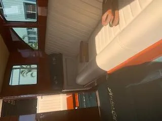  Yacht Photos Pics Interior of 2019 Hacker-Craft 35 Sea Limo Commuter with white seating and wooden accents.