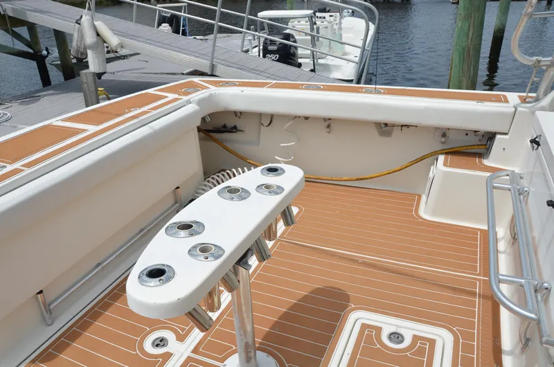 Double Trouble Yacht Photos Pics 1992 Tiara Yachts 43 Open deck with rod holders and teak flooring.