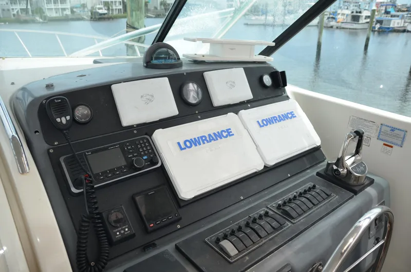 Double Trouble Yacht Photos Pics Control panel of a 1992 Tiara Yachts 43 Open with Lowrance equipment.