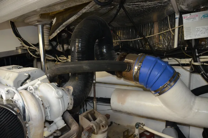 Double Trouble Yacht Photos Pics Engine room of 1992 Tiara Yachts 43 Open, showing exhaust system and components.
