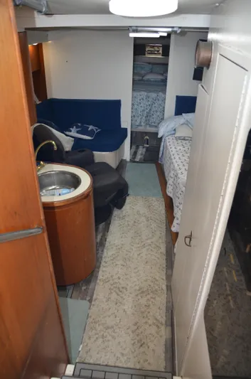 Double Trouble Yacht Photos Pics Interior of 1992 Tiara Yachts 43 Open, featuring cozy seating and compact kitchen area.