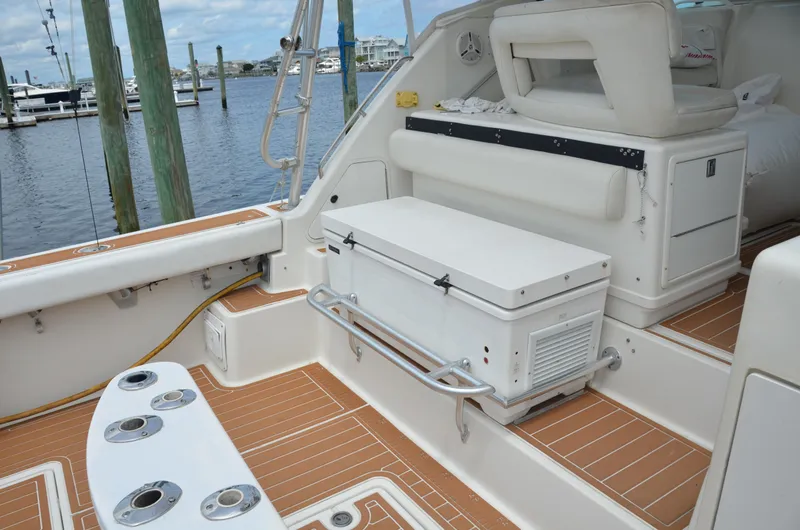 Double Trouble Yacht Photos Pics 1992 Tiara Yachts 43 Open deck with seating and storage, docked at marina.