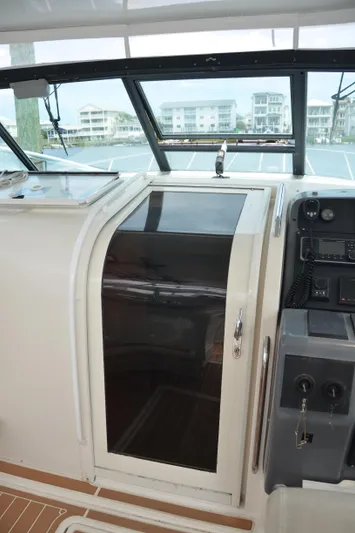 Double Trouble Yacht Photos Pics 1992 Tiara Yachts 43 Open helm with control panel and cabin door.