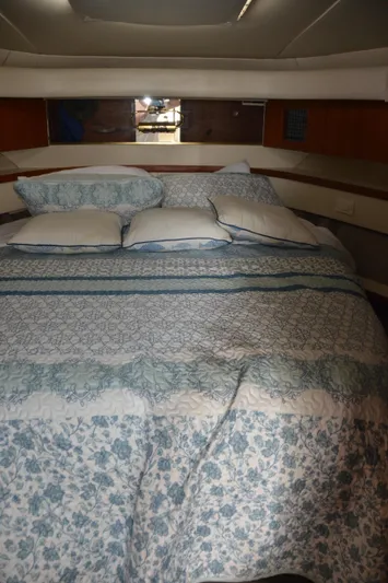 Double Trouble Yacht Photos Pics 1992 Tiara Yachts 43 Open cabin with a cozy, floral-patterned bed.