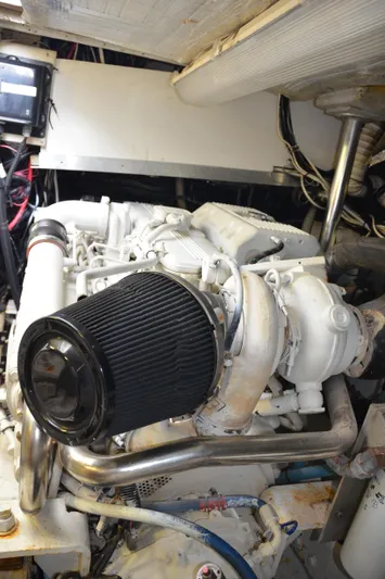 Double Trouble Yacht Photos Pics Engine room of 1992 Tiara Yachts 43 Open, showcasing a well-maintained marine engine.