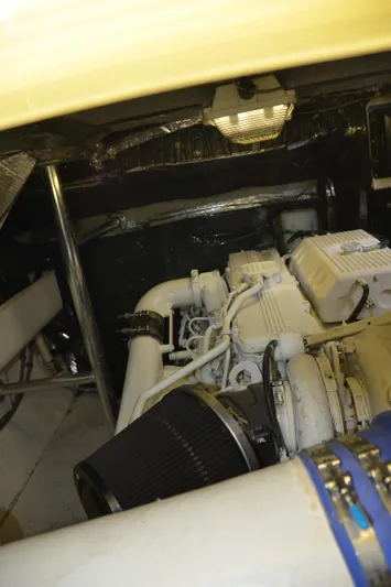 Double Trouble Yacht Photos Pics Engine room of 1992 Tiara Yachts 43 Open, showcasing mechanical components and piping.