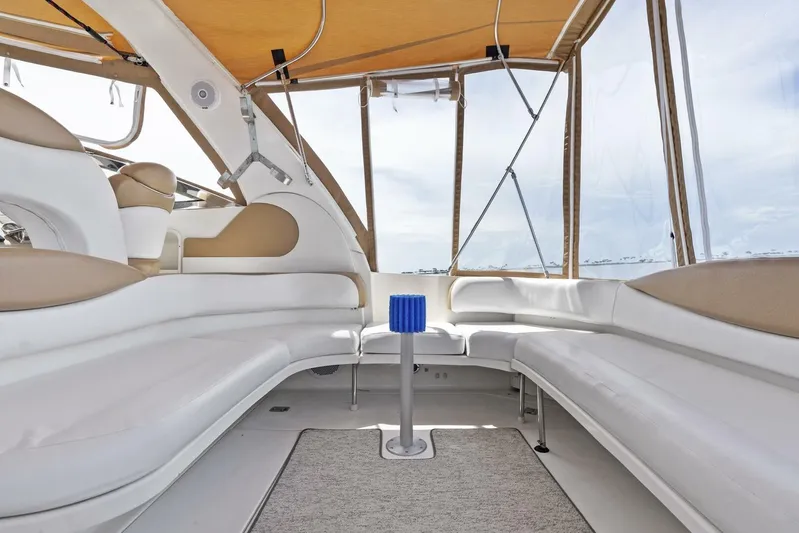  Yacht Photos Pics Interior of 2001 Sea Ray 380 Sundancer yacht with white seating and canopy.