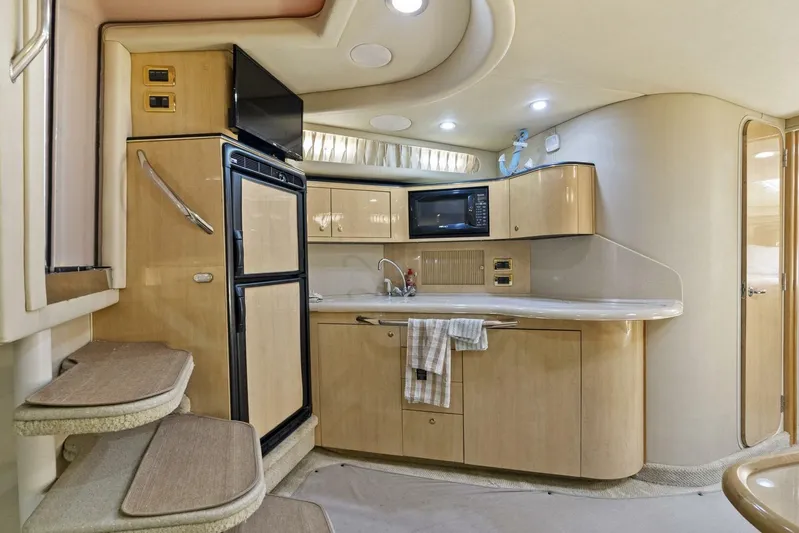  Yacht Photos Pics 2001 Sea Ray 380 Sundancer interior kitchen with modern appliances and sleek cabinetry.