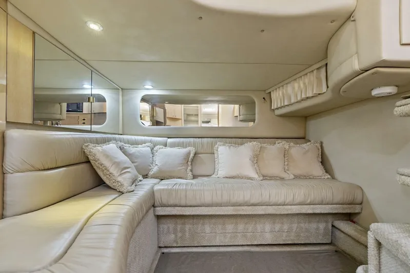  Yacht Photos Pics Luxurious interior of 2001 Sea Ray 380 Sundancer yacht with plush seating and cushions.