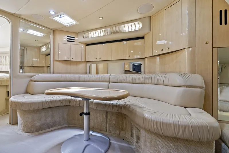  Yacht Photos Pics Luxurious interior of 2001 Sea Ray 380 Sundancer yacht with plush seating and cabinetry.