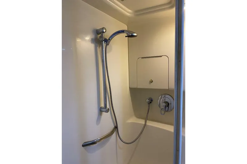  Yacht Photos Pics Shower area in 2001 Sea Ray 380 Sundancer yacht, featuring chrome fixtures.