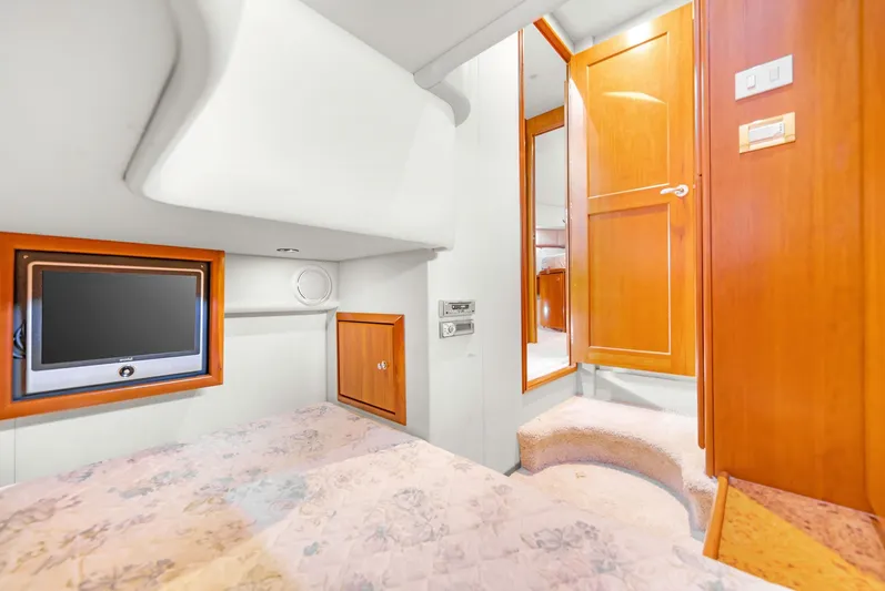  Yacht Photos Pics Interior of 2007 Silverton 45 Convertible with TV and wooden furnishings.