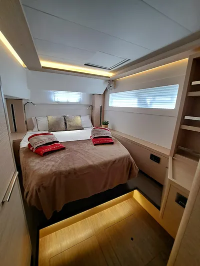  Yacht Photos Pics Luxurious cabin interior of 2023 Lagoon 46 yacht with modern design and ambient lighting.