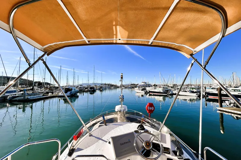 Serafina Yacht Photos Pics 2019 Ranger Tugs R-29 CB boat docked in a marina under clear blue skies.
