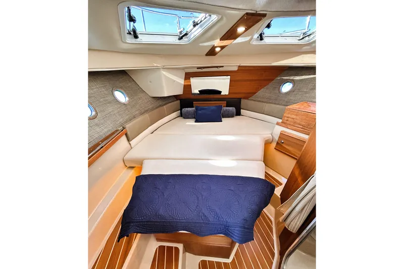 Serafina Yacht Photos Pics 2019 Ranger Tugs R-29 CB cabin interior with skylights and cozy bedding.