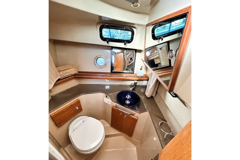 Serafina Yacht Photos Pics 2019 Ranger Tugs R-29 CB bathroom with modern fixtures and porthole window.