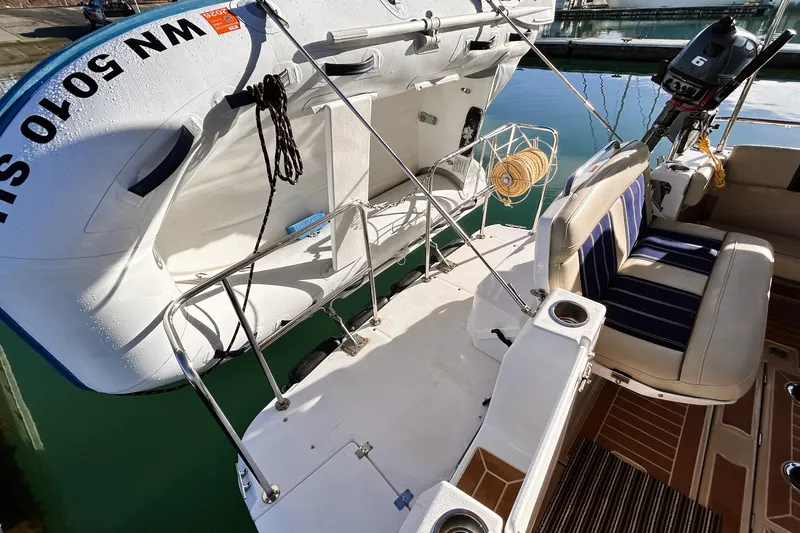 Serafina Yacht Photos Pics 2019 Ranger Tugs R-29 CB boat with inflatable dinghy and seating area.