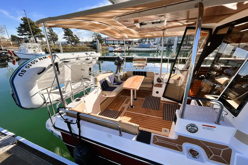 Serafina Yacht Photos Pics 2019 Ranger Tugs R-29 CB boat interior with seating and table at marina.