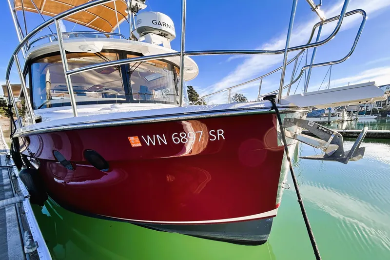 Serafina Yacht Photos Pics 2019 Ranger Tugs R-29 CB boat docked, red hull, marina background.