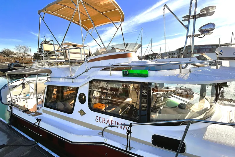 Serafina Yacht Photos Pics 2019 Ranger Tugs R-29 CB boat docked, featuring upper deck and sleek design.