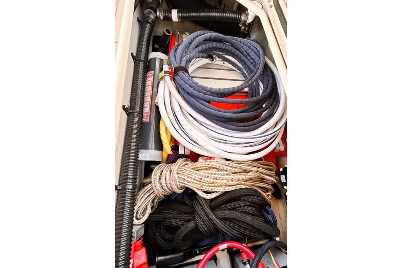 Serafina Yacht Photos Pics Storage compartment with coiled ropes and hoses on a 2019 Ranger Tugs R-29 CB boat.