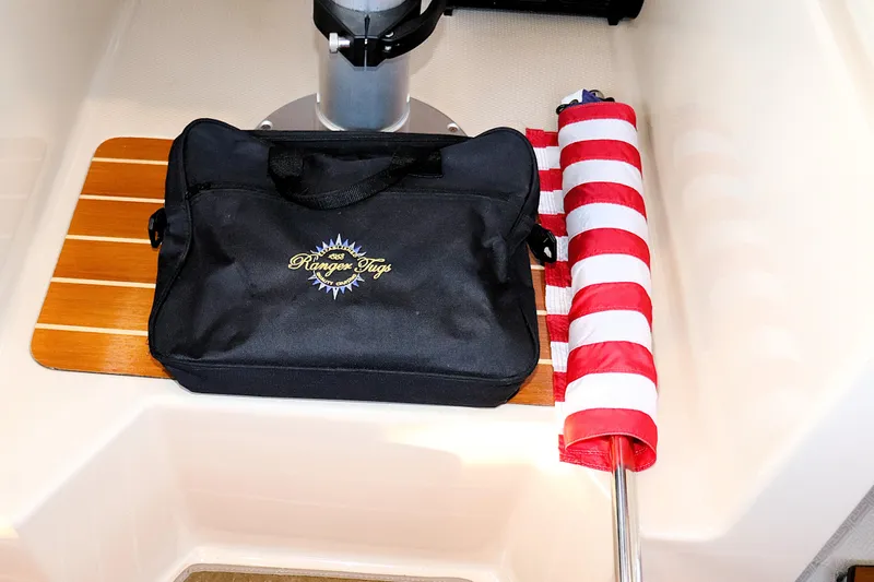 Serafina Yacht Photos Pics Black Ranger Tugs bag and rolled flag on 2019 R-29 CB boat deck.