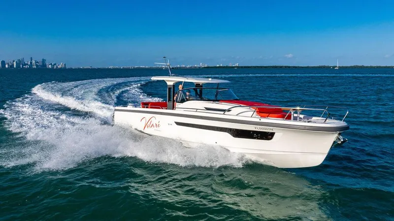 Volare Yacht Photos Pics 2023 Nimbus T11 boat cruising on open water under clear blue skies.