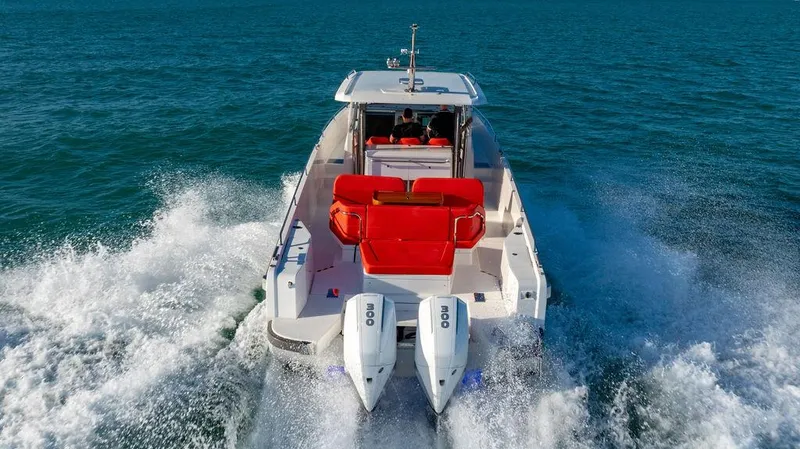 Volare Yacht Photos Pics Nimbus T11 2023 boat cruising on open water with dual engines.