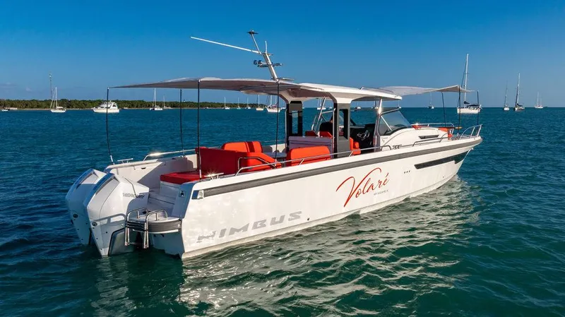 Volare Yacht Photos Pics 2023 Nimbus T11 boat on water, featuring sleek design and vibrant seating.