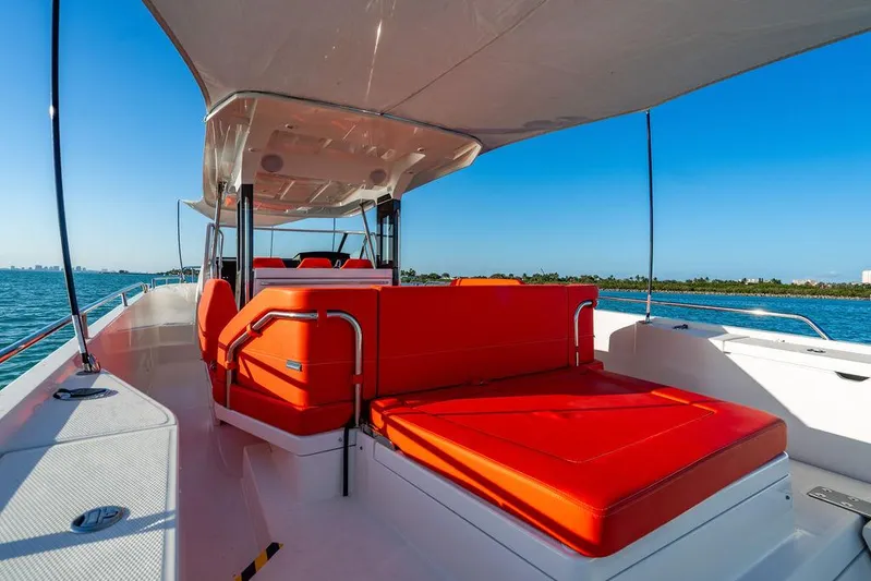Volare Yacht Photos Pics 2023 Nimbus T11 boat with vibrant red seating on a sunny day.