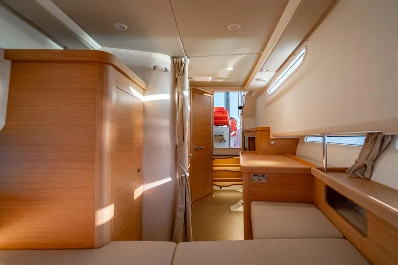 Volare Yacht Photos Pics Interior of 2023 Nimbus T11 yacht, featuring modern wood finishes and cozy seating.