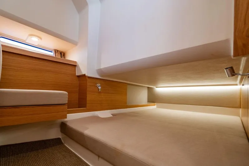 Volare Yacht Photos Pics 2023 Nimbus T11 interior cabin with modern wood finish and ambient lighting.