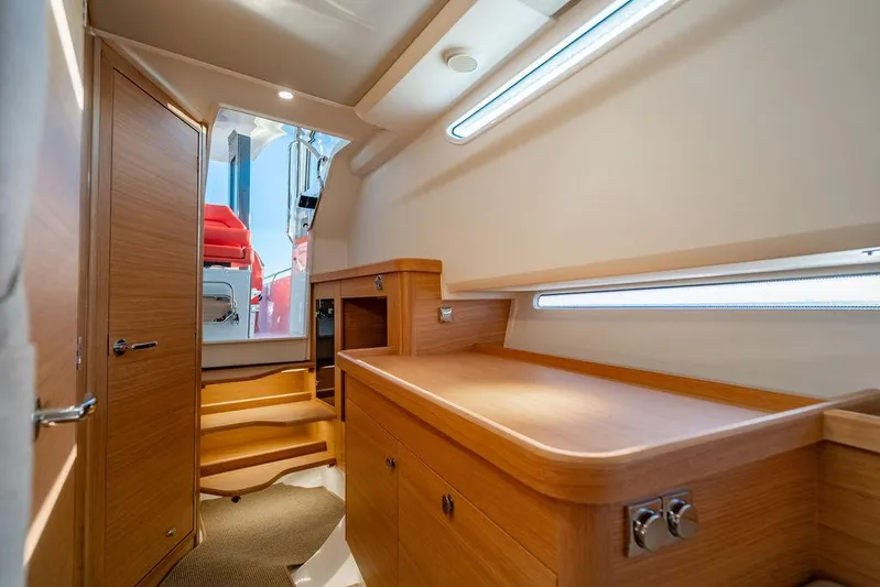 Volare Yacht Photos Pics Interior of 2023 Nimbus T11 yacht with wooden cabinetry and modern design.