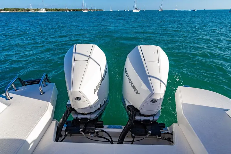 Volare Yacht Photos Pics Twin Mercury outboard engines on a 2023 Nimbus T11 boat in open water.