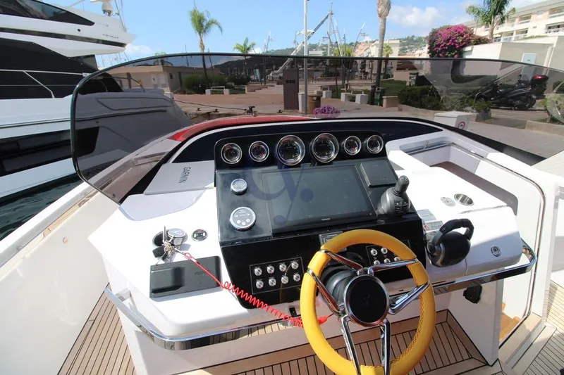 S Yacht Photos Pics 2024 Frauscher 1414 Demon Air yacht helm with modern controls and yellow steering wheel.