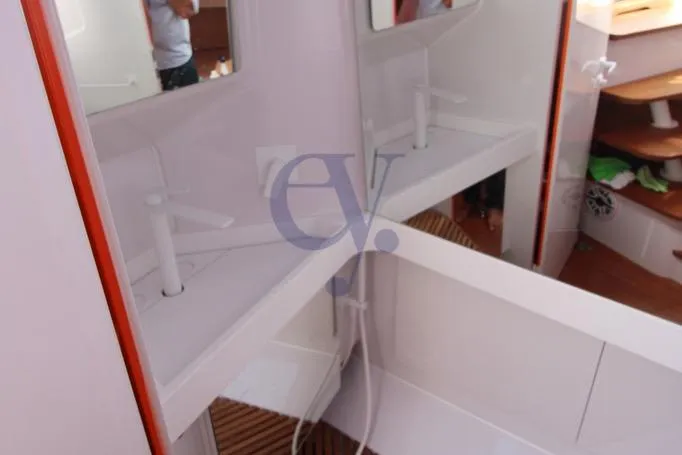 S Yacht Photos Pics 2024 Frauscher 1414 Demon Air yacht interior with modern white fixtures and mirrors.