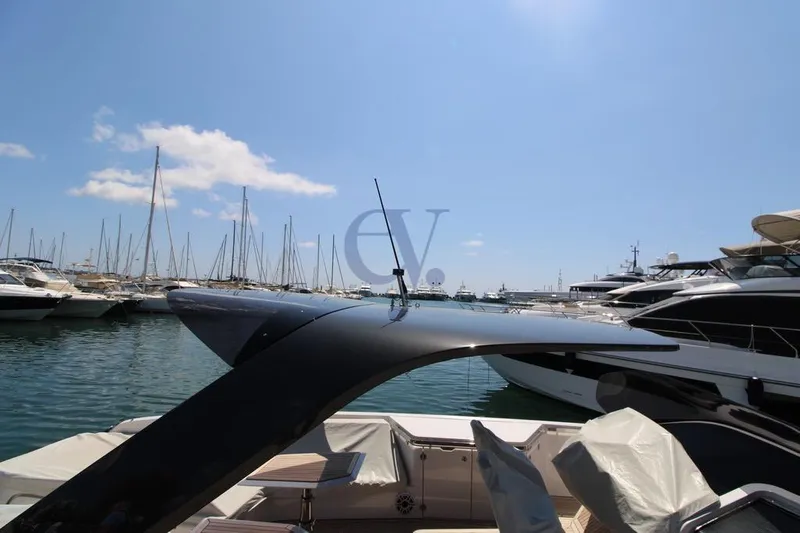 S Yacht Photos Pics 2024 Frauscher 1414 Demon Air yacht docked in a marina under a clear blue sky.