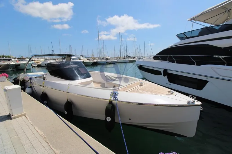 S Yacht Photos Pics 2024 Frauscher 1414 Demon Air yacht docked in a sunny marina.