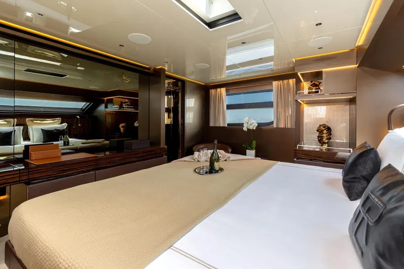 Nangara Yacht Photos Pics Luxurious bedroom interior of 2024 Sanlorenzo SL 106 Asymmetric yacht with elegant decor.