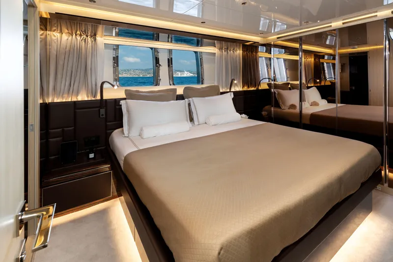 Nangara Yacht Photos Pics Luxurious bedroom interior of 2024 Sanlorenzo SL 106 Asymmetric yacht with ocean view.