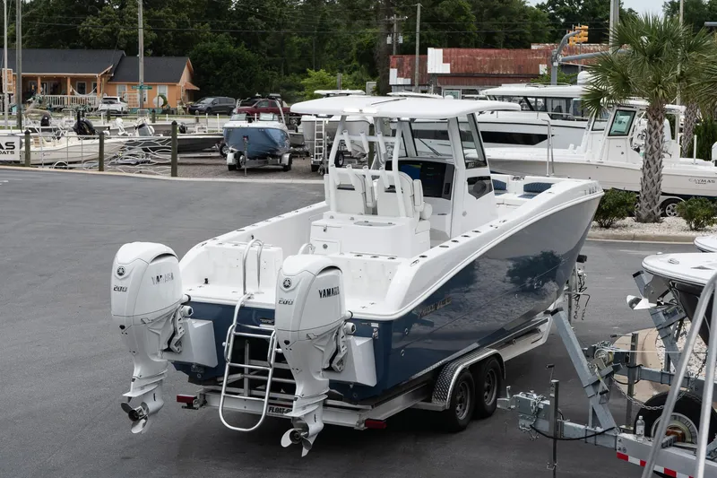  Yacht Photos Pics 2025 Twin Vee 260 GFX2 CC boat with dual Yamaha engines on a trailer.