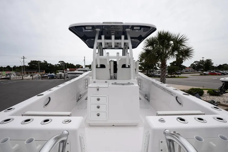  Yacht Photos Pics 2025 Twin Vee 260 GFX2 CC boat, center console, sleek design, spacious deck, palm tree background.