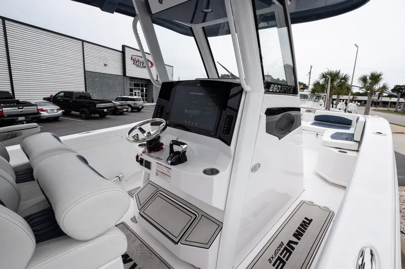  Yacht Photos Pics 2025 Twin Vee 260 GFX2 CC boat interior with modern console and seating.