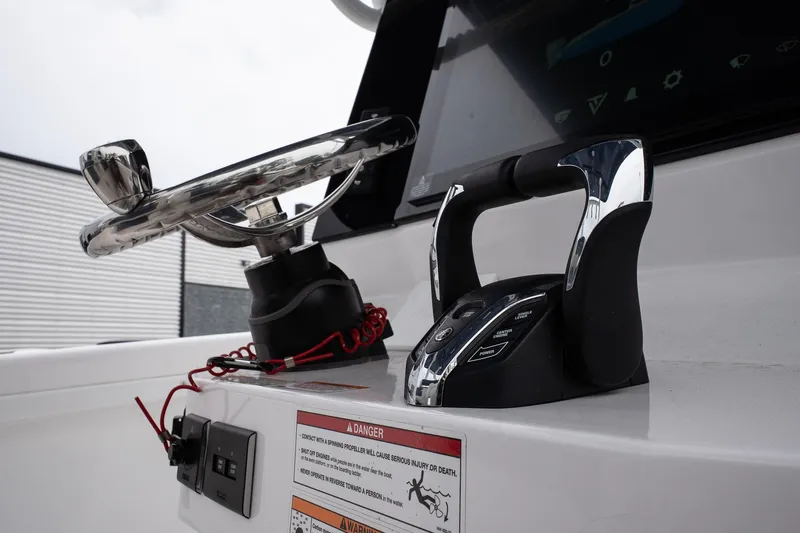 Yacht Photos Pics 2025 Twin Vee 260 GFX2 CC boat dashboard with steering wheel and controls.
